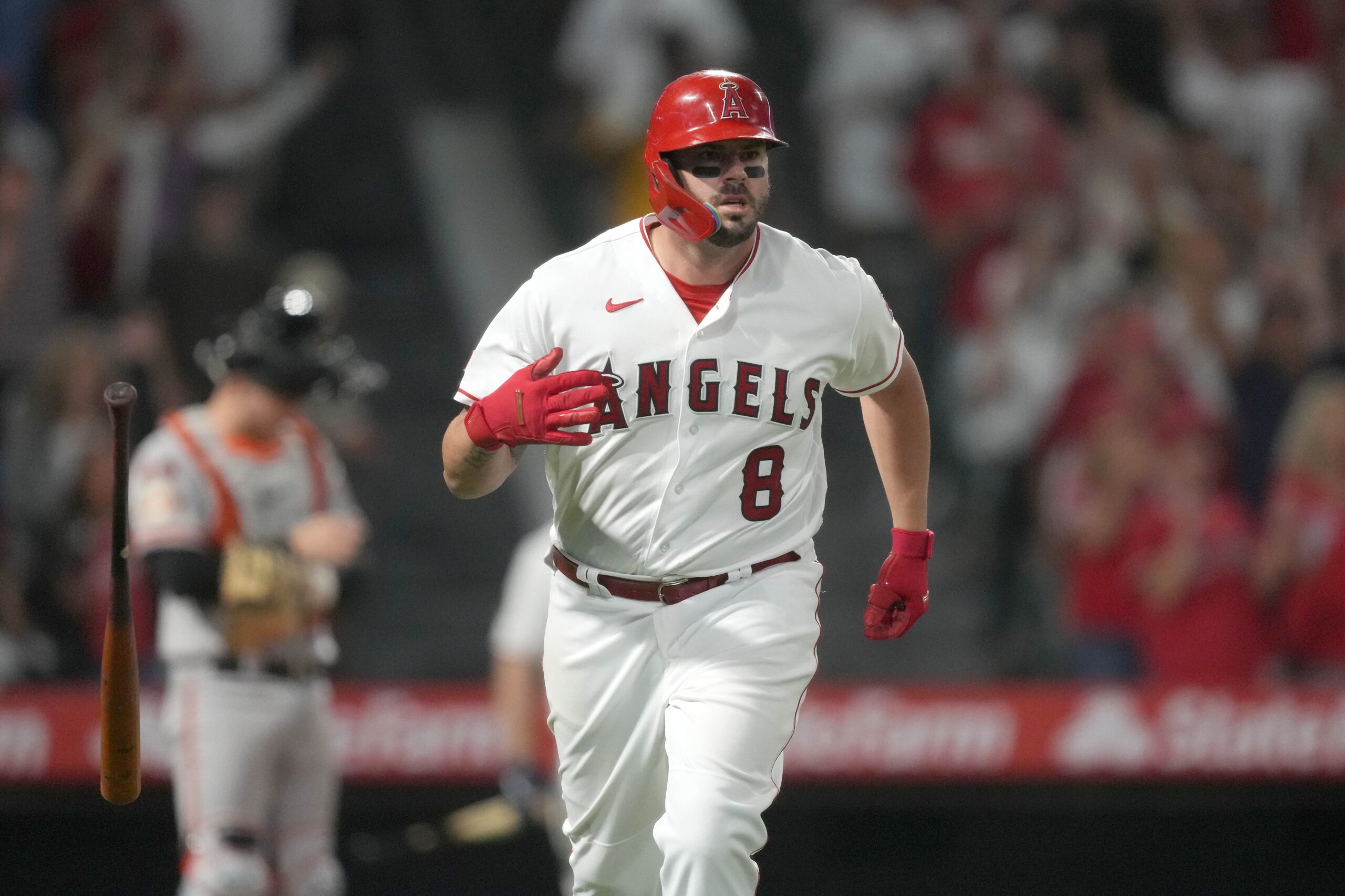 Los Angeles Angels' Mike Moustakas celebrates after hitting a
